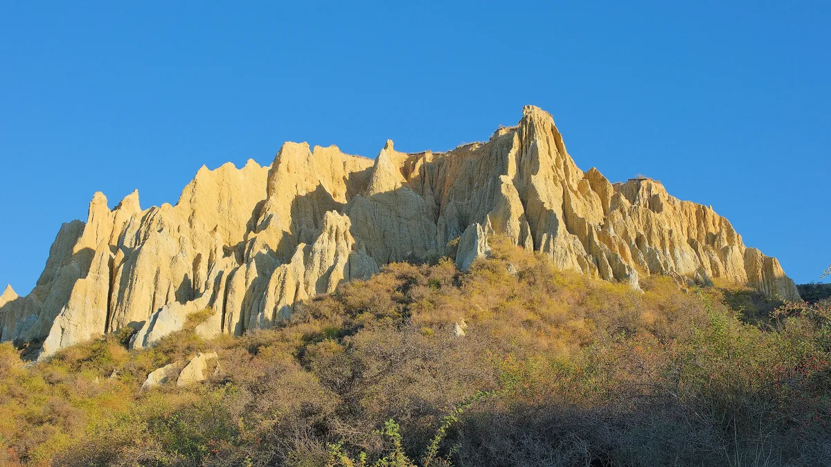 Eroded clay pinnacles of the Ōmarama Clay Cliffs in early morning light