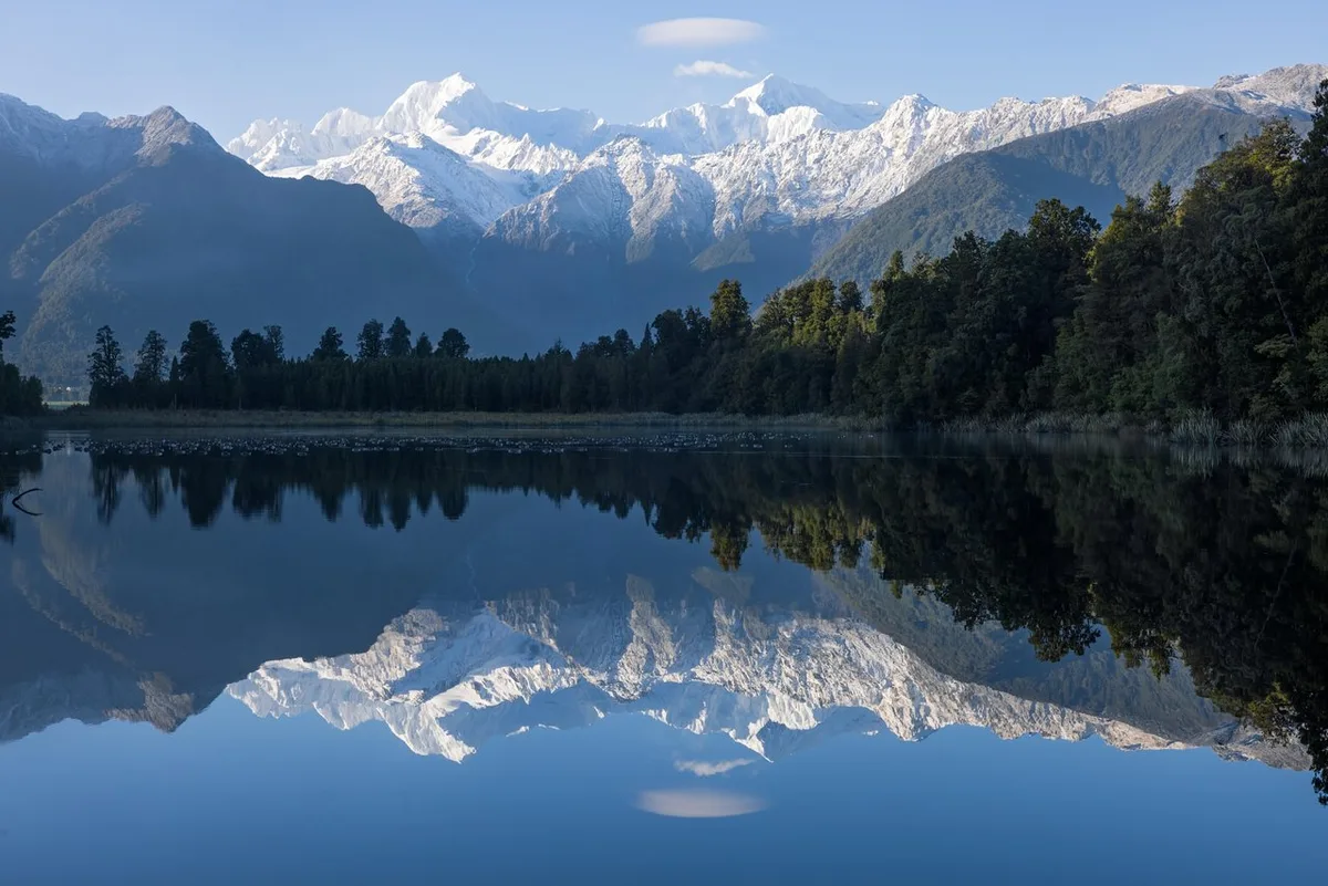 The Southern Alps reflected in Lake Matheson near Fox Glacier